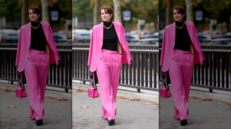 woman wearing neon pink suit