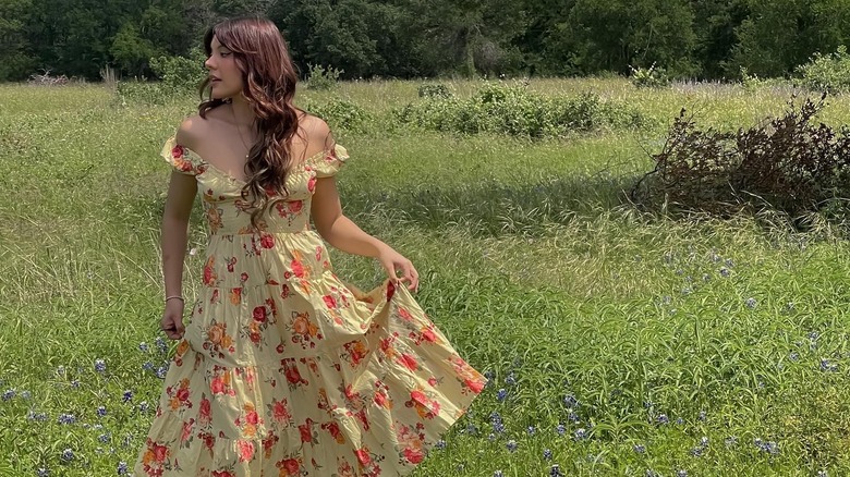 Woman with curtain bangs walking
