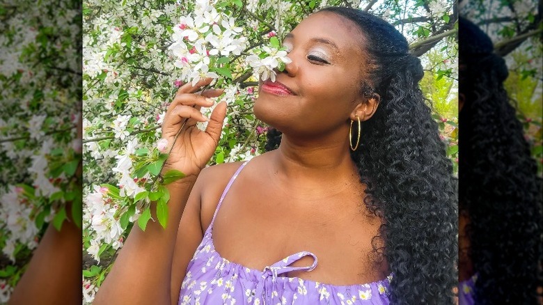 Woman smelling flowers