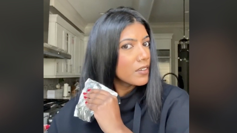Rubbing tin foil on hair