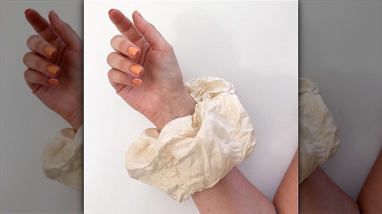 woman with creamsicle nails