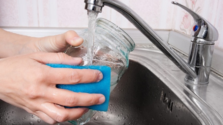 Hand-washing a candle jar