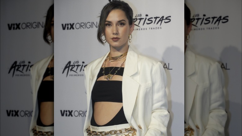 Woman posing in white suite