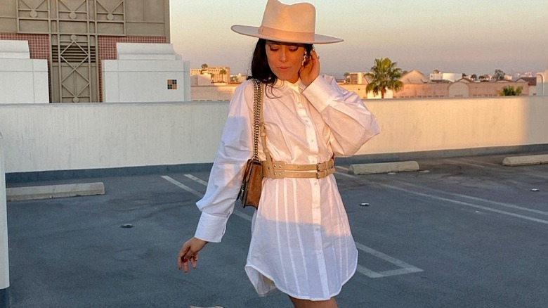 Woman in white button-up dress