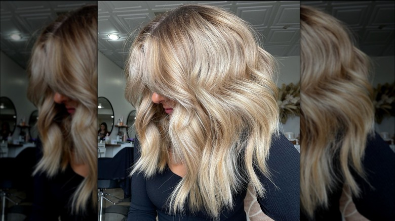 Woman models crème brûlée blond hair