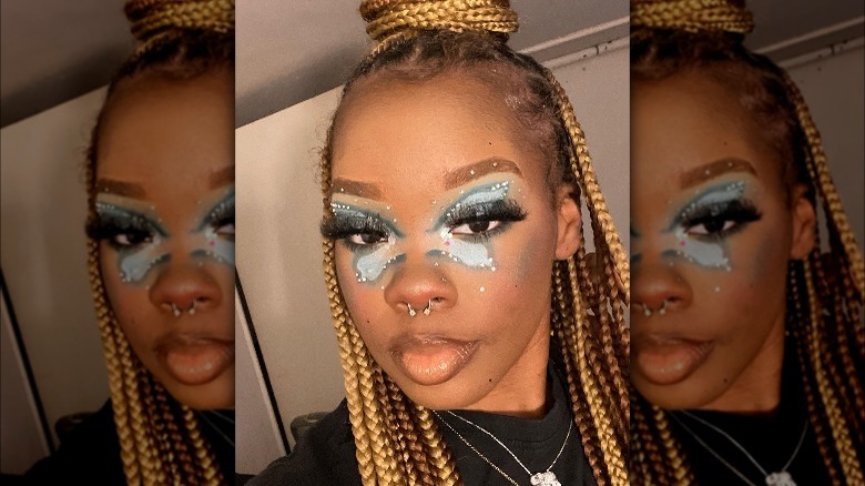 A woman with butterfly makeup