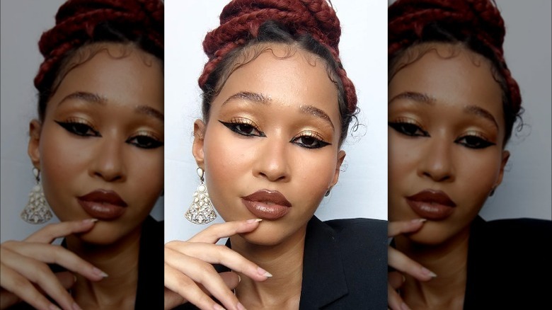 A woman with glitter eyebrows