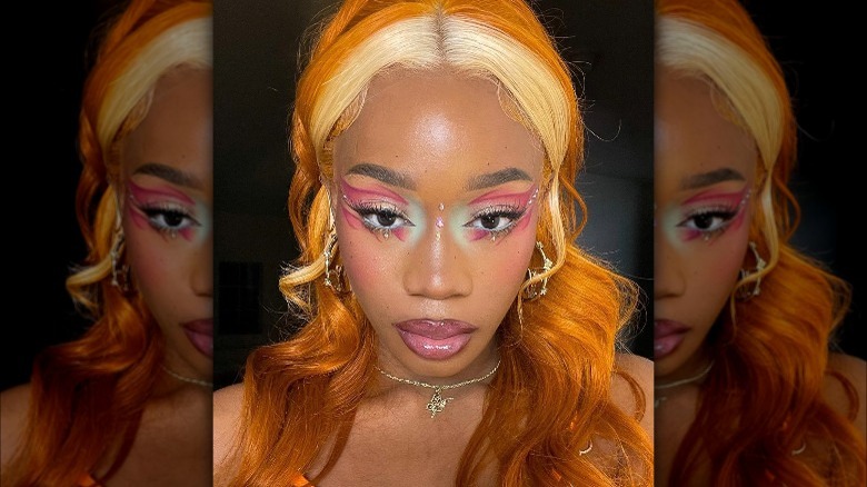 A woman with pink eye makeup