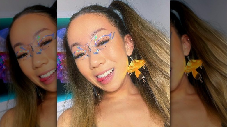 A woman with holographic makeup