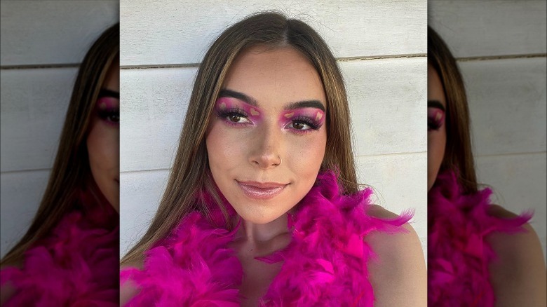 A woman with pink makeup