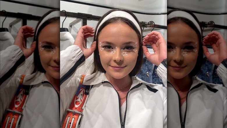 A woman with white stars on her face