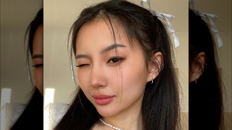 Woman with dainty curve bangs