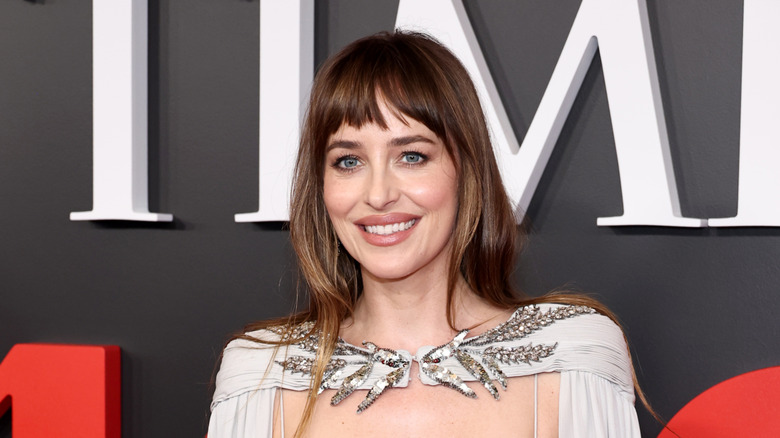Dakota Johnson smiles at the Time 100 event