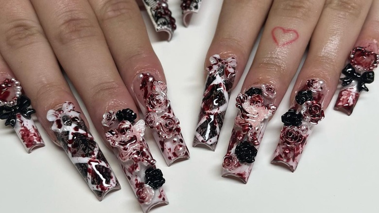 balletcore nails with red splashes