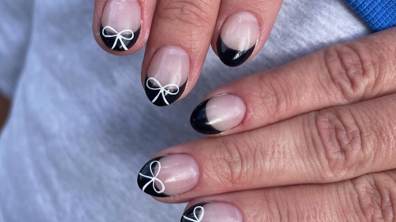 Black french manicure with bows