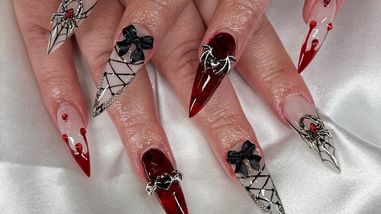 red and black nails with bows