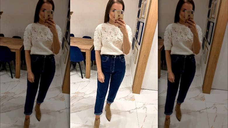 Woman wearing dark jeans