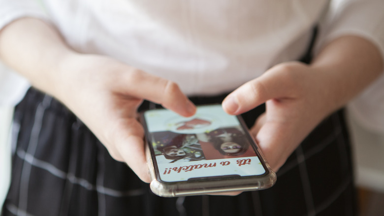 woman using dating app