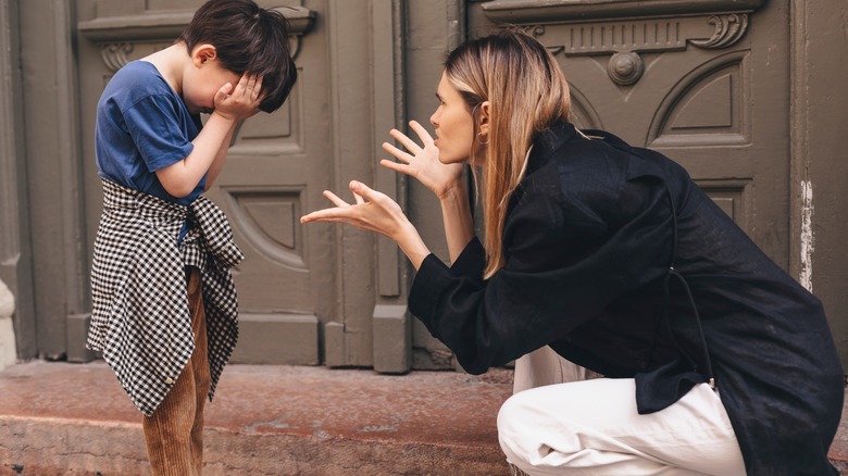 Mother yells at young son