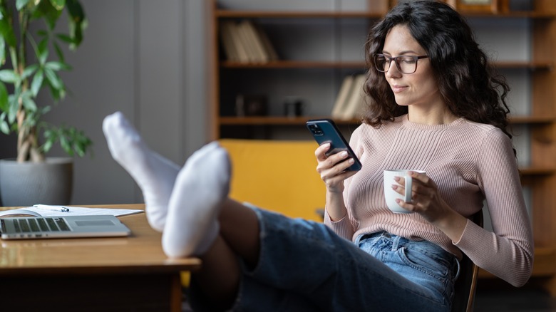 relaxed woman using phone