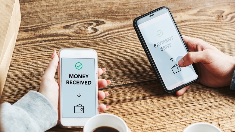 couple holding phones