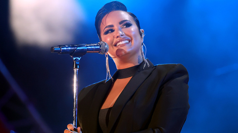 Demi Lovato performing with short hair