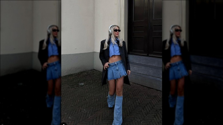 Woman in denim boots, miniskirt