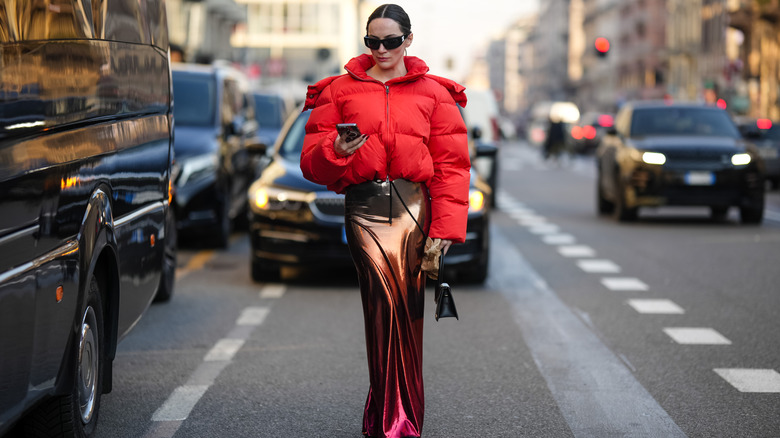 Woman wearing metallic maxi skirt