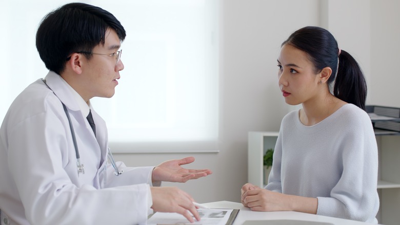 Doctor speaks with patient