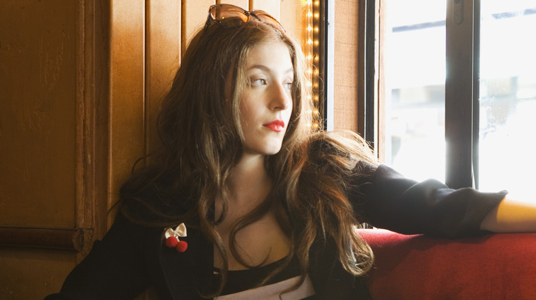 woman wondering on couch