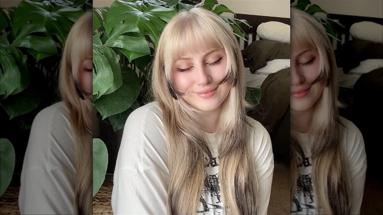 Blond layered cut with black dip dye tips