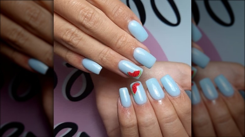 blue nailpolish with watermelon art