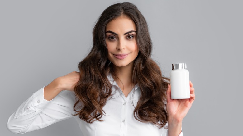 woman posing with vitamins