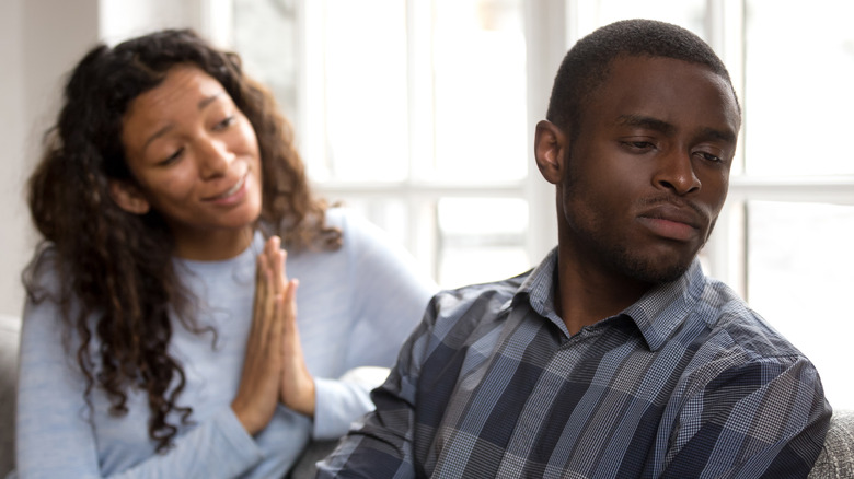 Man turning away from woman