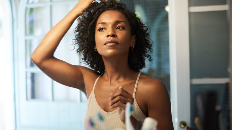 Woman styling hair