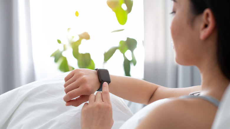 woman looking at watch