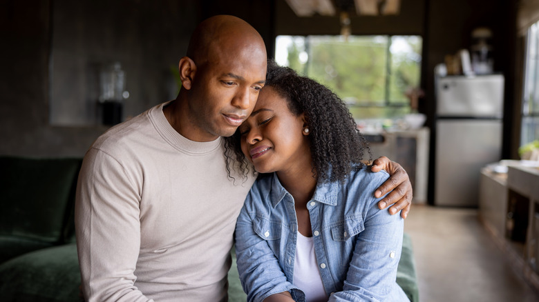 A couple grieving together