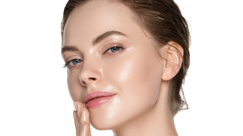 woman touching healthy skin