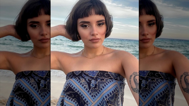 Woman with straight micro-bangs