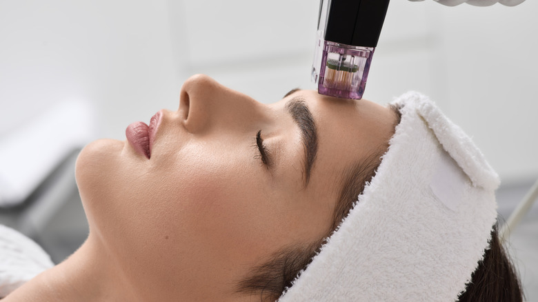 A woman getting microneedling
