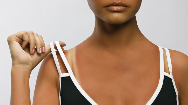 woman adjusting bra strap