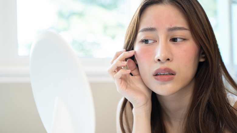 girl looking in the mirror 