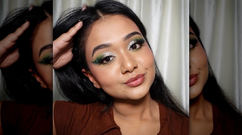 woman with green and white eyeshadow