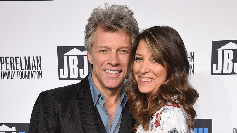 Jon Bon Jovi posing with his wife Dorothea Hurley at a red carpet event.