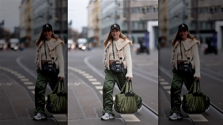 woman carrying nylon bag and crossboy