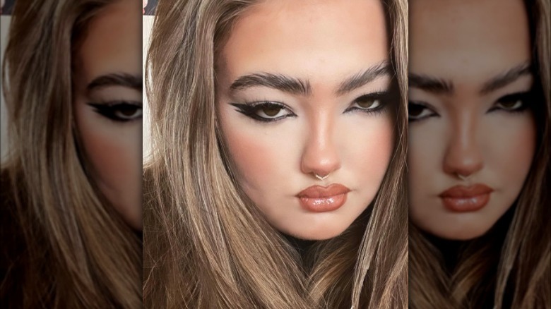 A woman with black double-winged eyeliner