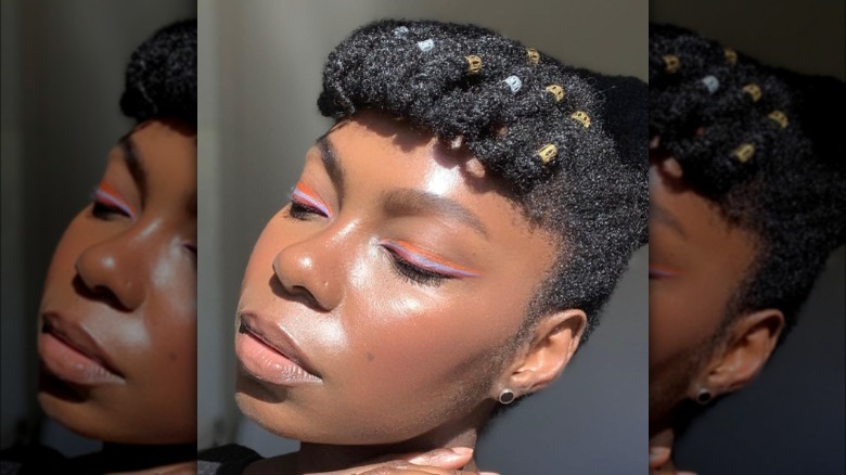 A woman wearing triple eyeliner