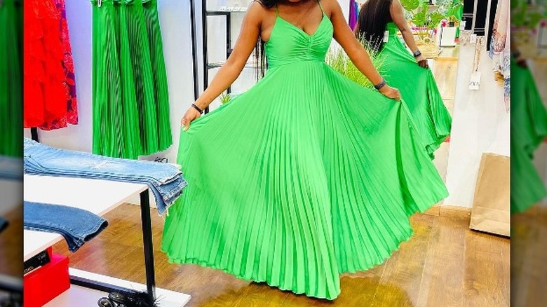 Woman in green pleated dress 