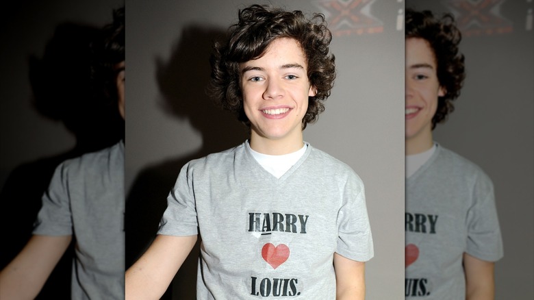 Harry Styles with his hair curled on The X Factor in 2011