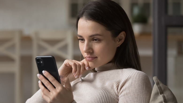 woman looking at phone